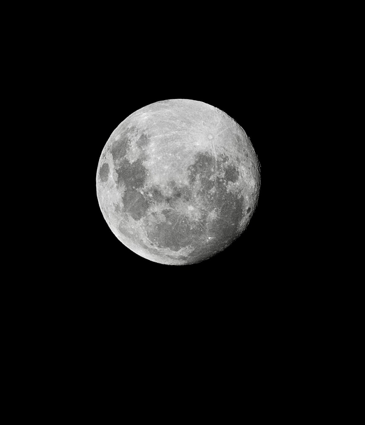 Isaiah’s photograph of the moon against a black sky